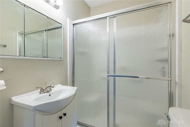 bathroom with toilet and an enclosed shower