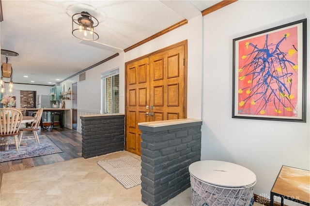 entrance foyer featuring crown molding