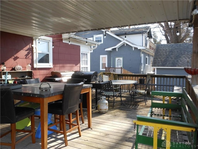 wooden deck with area for grilling