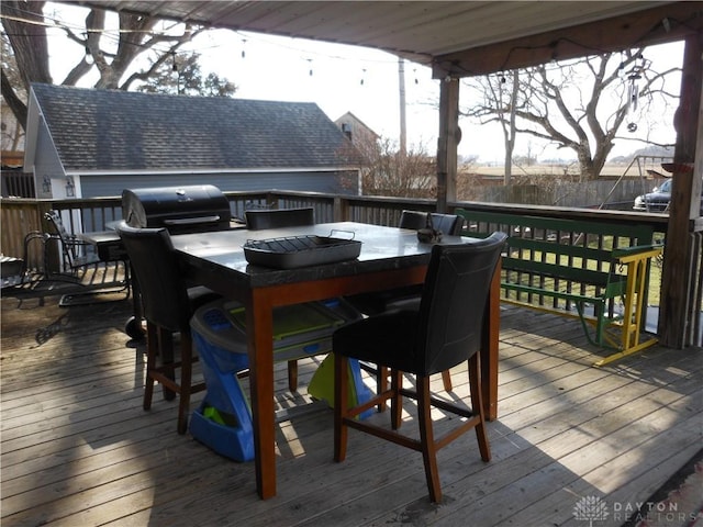 wooden deck featuring area for grilling