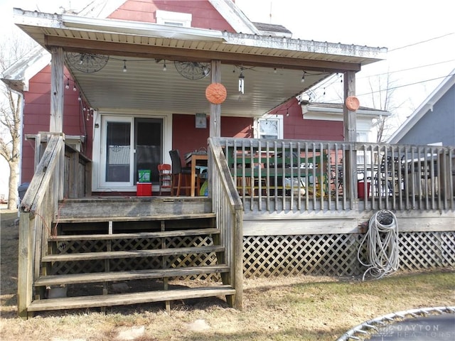 back of property featuring a porch