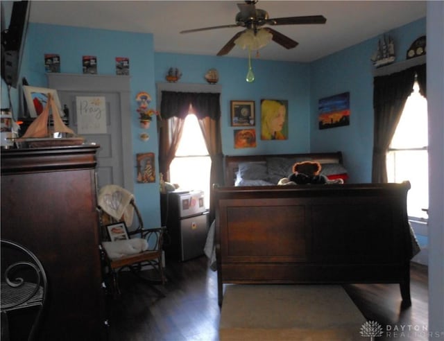 bedroom with hardwood / wood-style flooring and ceiling fan