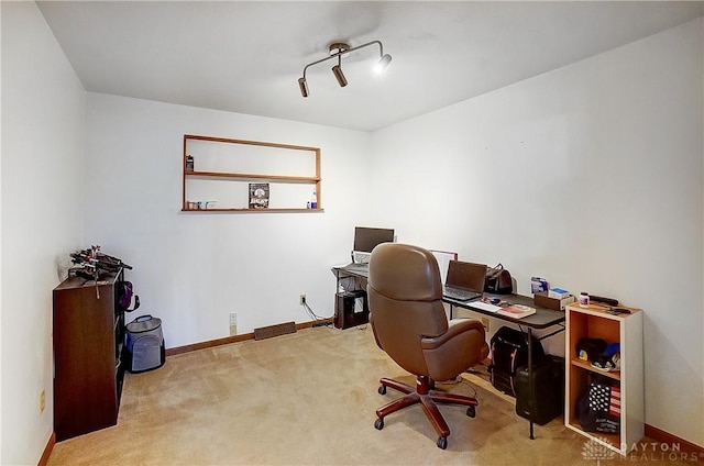 office featuring light carpet and baseboards