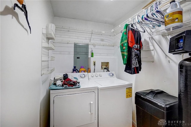 washroom featuring laundry area, washing machine and dryer, and electric panel