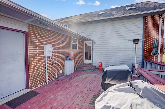 wooden deck with area for grilling