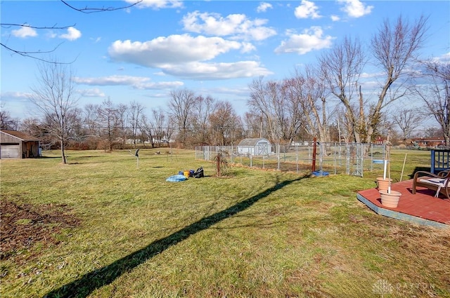 view of yard with a vegetable garden and an outdoor structure