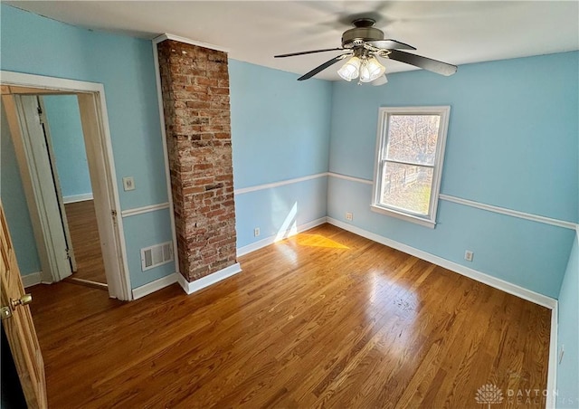 unfurnished room with wood-type flooring and ceiling fan