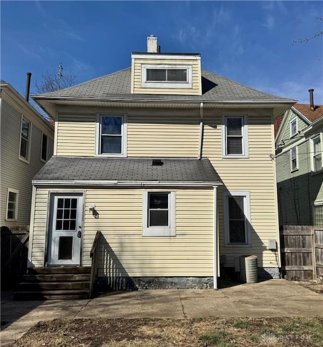 rear view of house with cooling unit