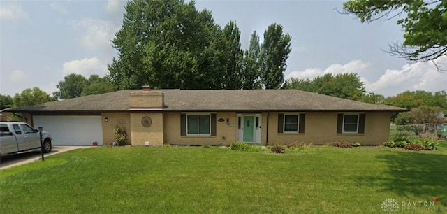 ranch-style home featuring a garage and a front lawn