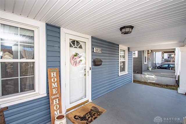 doorway to property featuring a porch