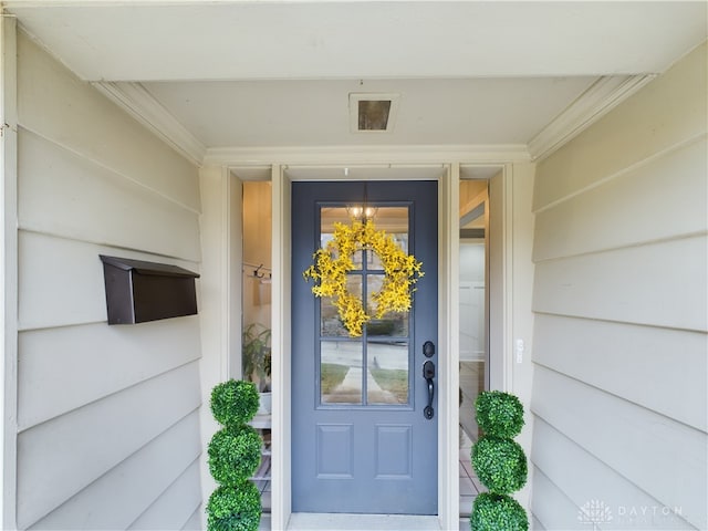 view of exterior entry featuring visible vents