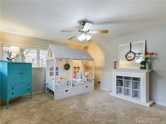 unfurnished bedroom featuring ceiling fan and carpet flooring