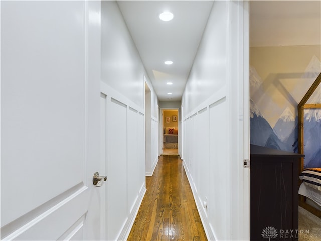 corridor with dark hardwood / wood-style floors