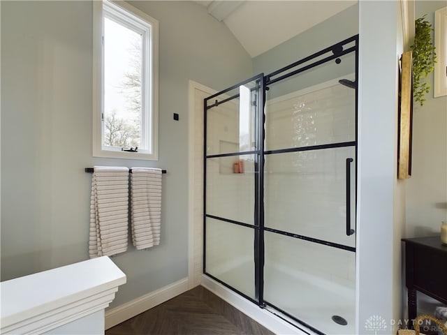 bathroom with parquet floors and an enclosed shower