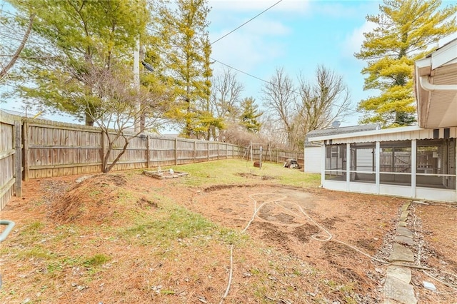 view of yard featuring a sunroom