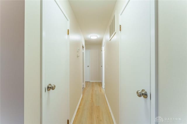 hallway with light wood-type flooring