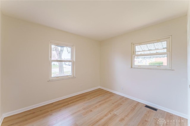 empty room with light wood-type flooring