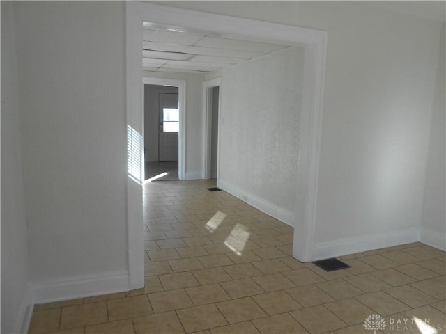 spare room featuring light tile patterned floors