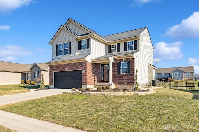 view of front of home featuring a garage, central AC unit, and a front lawn