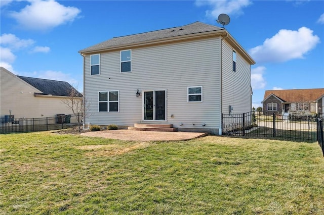 back of property featuring a yard and a patio