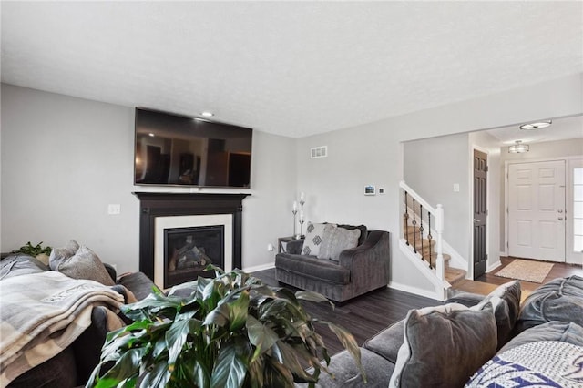 living room with dark hardwood / wood-style flooring