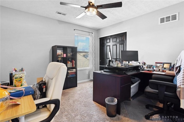 office with light carpet, a textured ceiling, and ceiling fan