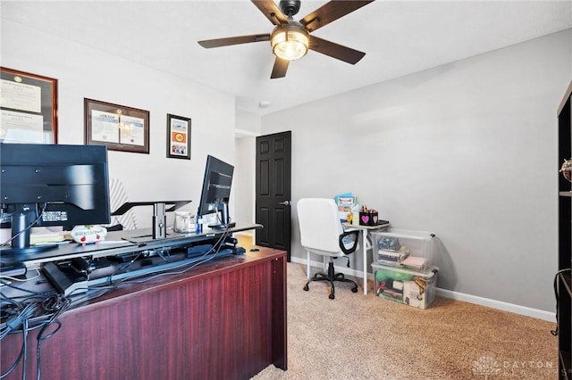 carpeted home office with ceiling fan