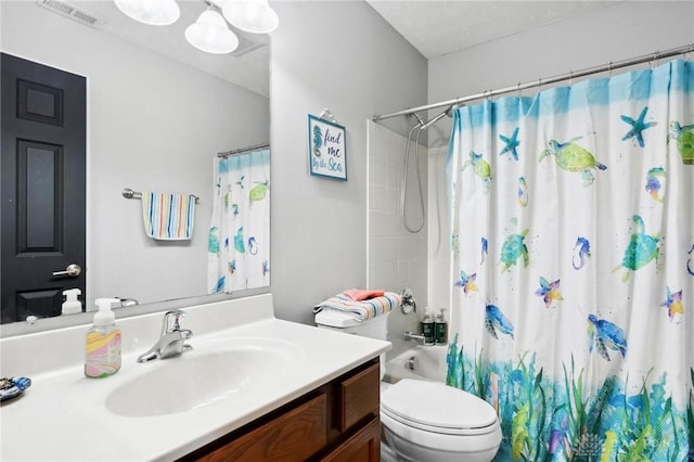 full bathroom featuring vanity, toilet, and shower / bathtub combination with curtain