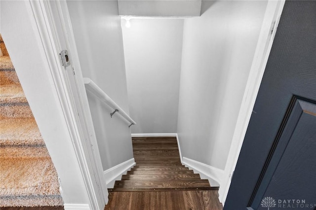 stairs featuring hardwood / wood-style flooring