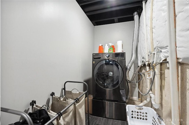 clothes washing area with washer / dryer