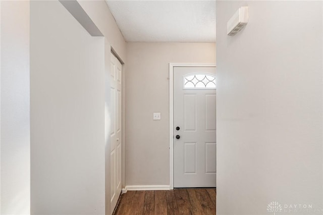 doorway featuring dark wood-type flooring