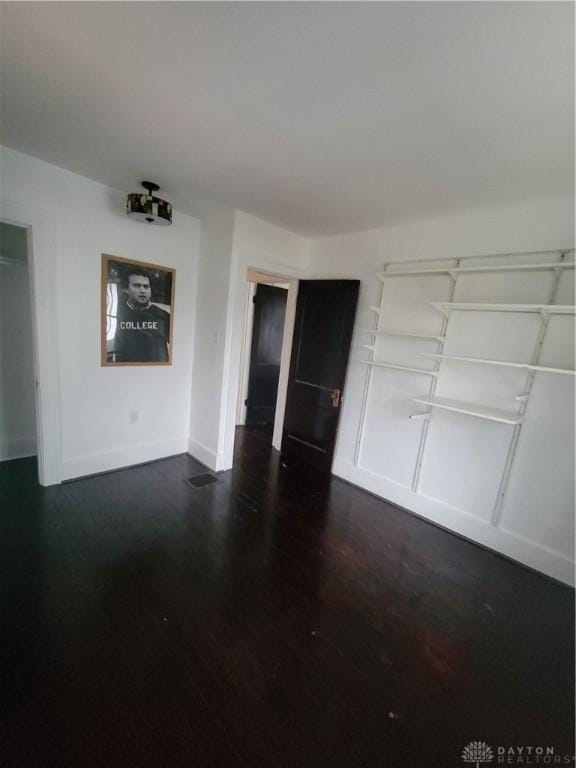 interior space with dark hardwood / wood-style flooring