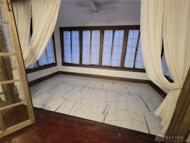 unfurnished room featuring ceiling fan