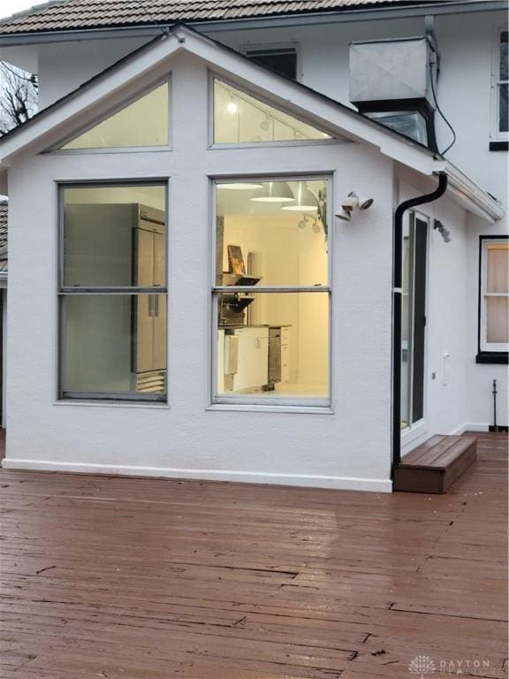 view of side of property with a wooden deck