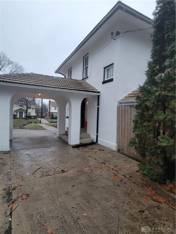 view of home's exterior featuring a carport