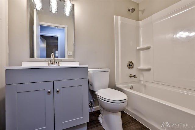 full bathroom featuring vanity, wood-type flooring, toilet, and shower / bath combination