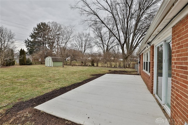 exterior space with a patio and a storage shed