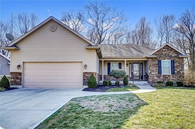 view of front of property featuring a garage, covered porch, and a front lawn