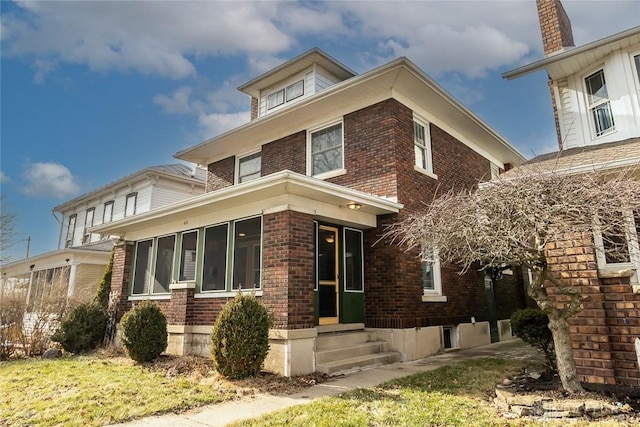 view of front facade featuring a sunroom