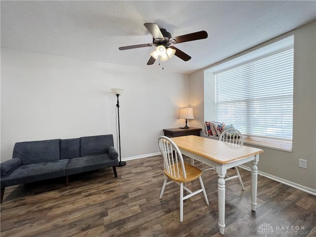 dining room featuring dark hardwood / wood-style flooring and ceiling fan