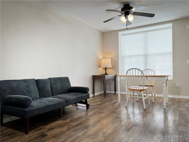 interior space featuring dark wood-type flooring and ceiling fan