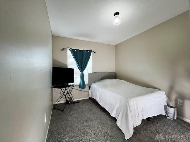 bedroom with dark carpet