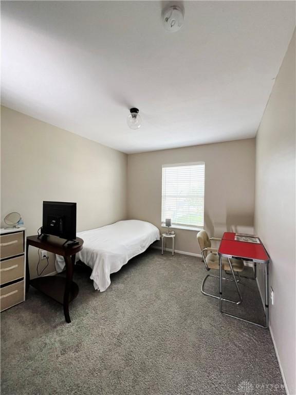 bedroom with dark carpet