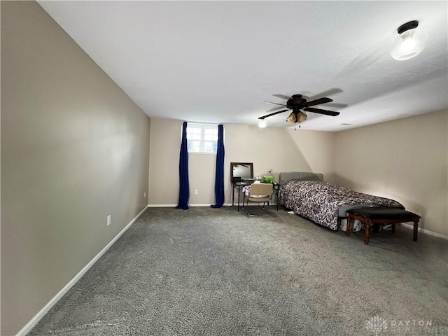 unfurnished bedroom featuring ceiling fan and carpet