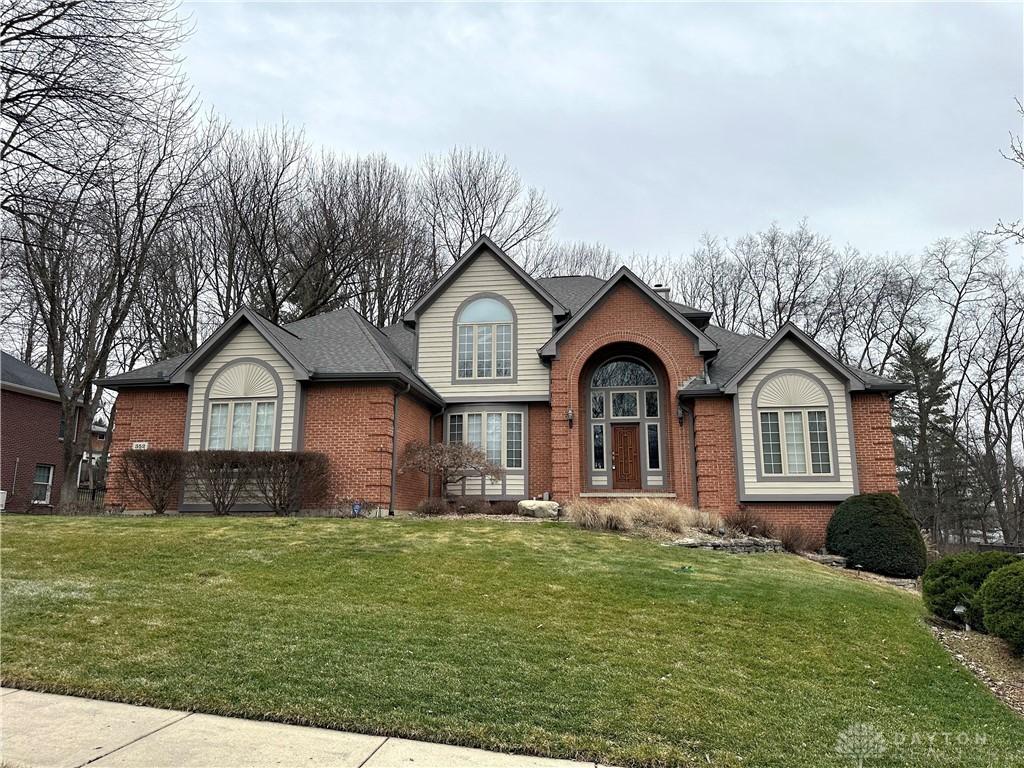 view of property with a front lawn