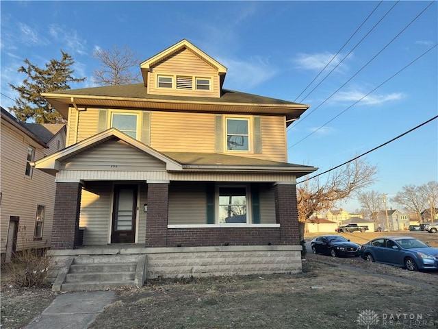 front of property featuring covered porch