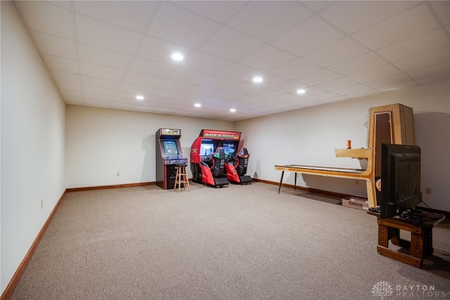 recreation room with carpet flooring and a drop ceiling