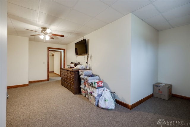 interior space with ceiling fan and a paneled ceiling