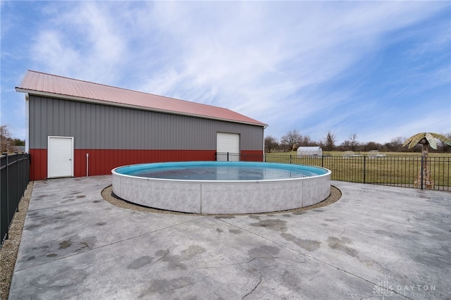 view of patio / terrace featuring a fenced in pool