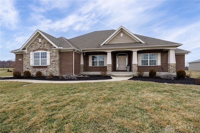 craftsman house featuring a front lawn